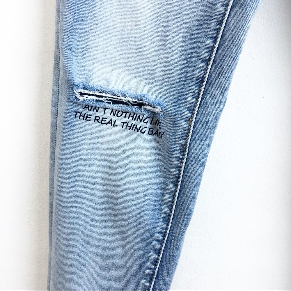 BIANCO 25 light wash distressed graphic jeans